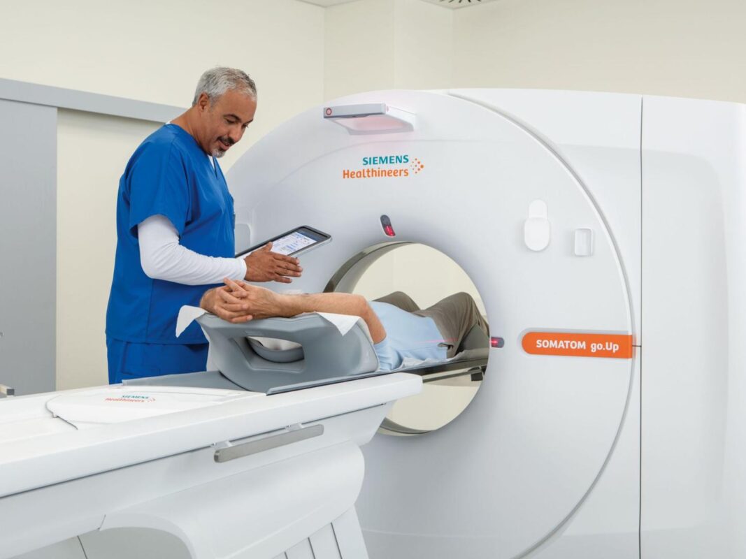 patient in Siemens Healthineers SOMATOM go.Up with doctor
